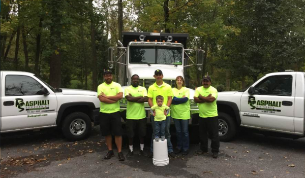 The RS Asphalt Maintenance team. Back row, from left to right: Tommy Bell, Tim Hayward, Casey Greinermiller (President), Gail Frey (Office Manager), Ruben Salazar. Front row, center: Dean Greinermiller. Not pictured: Dennis Brenizer