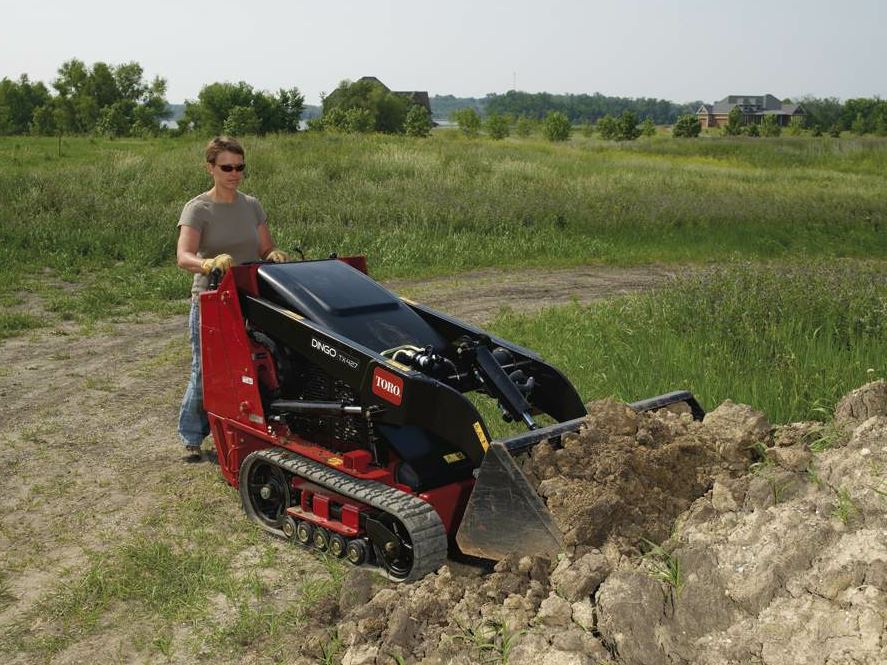 Once you have concrete (or landscaping bits) broken up, the skid steer operator can quickly switch out the hydraulic breaker for a bucket to remove the rubble from the project. Photo courtesy Chicago Pneumatic.