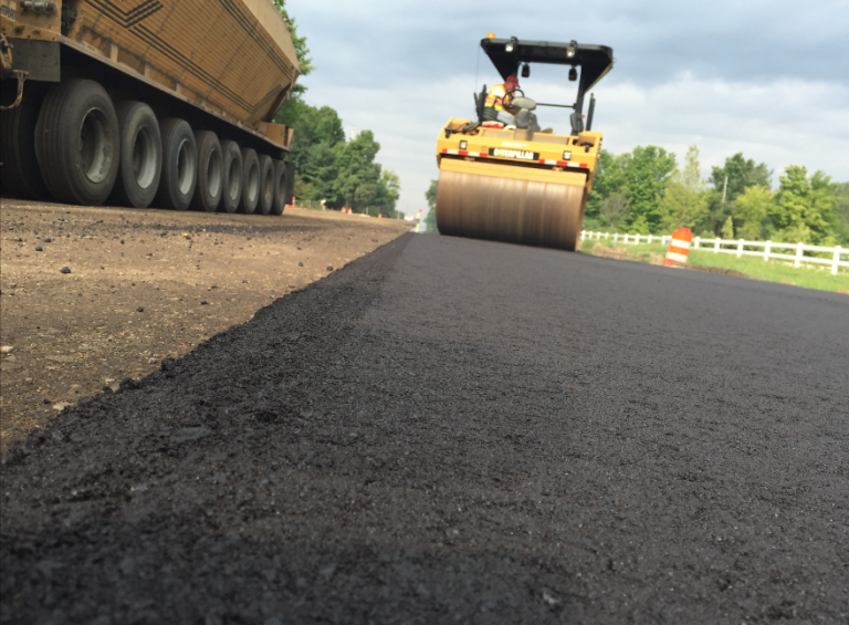 If you notice a tender zone coming up with the treated crumb rubber mix, make sure you get the breakdown roller on the mat directly behind the screed to get density quickly. Photos courtesy Liberty Tire Recycling.