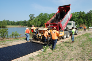 The Allen Asphalt Services crew from Smiths Station, Alabama, performs a number of projects for Auburn University. For the month of June, their work included placing the walking path of porous asphalt pavement around the pond at The Edward Via College of Osteopathic Medicine (VCOM). Photos courtesy NCAT.