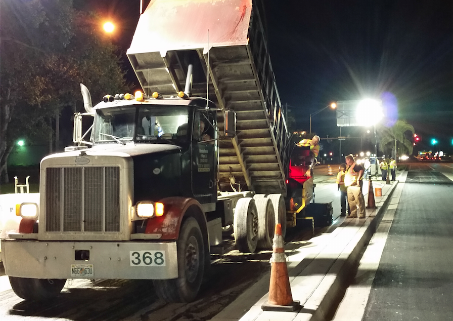 Delivering mix to a nighttime paving site takes even more attention to detail. Drivers will want to be aware of their surroundings always, but the onset of dusk brings new elements of danger with shortened work zones due to limited sight. Be safe out there. Photo courtesy Sandy Lender.