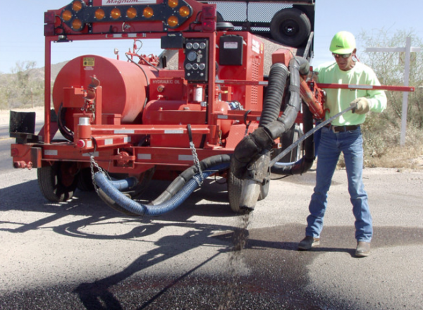 Spray injection patching cleans, tacks, fills and compacts in one continuous operation. The process requires a one- or two-person crew, can be used in cool or damp conditions, and doesn’t require a roller. Photo courtesy of Crafco Inc.