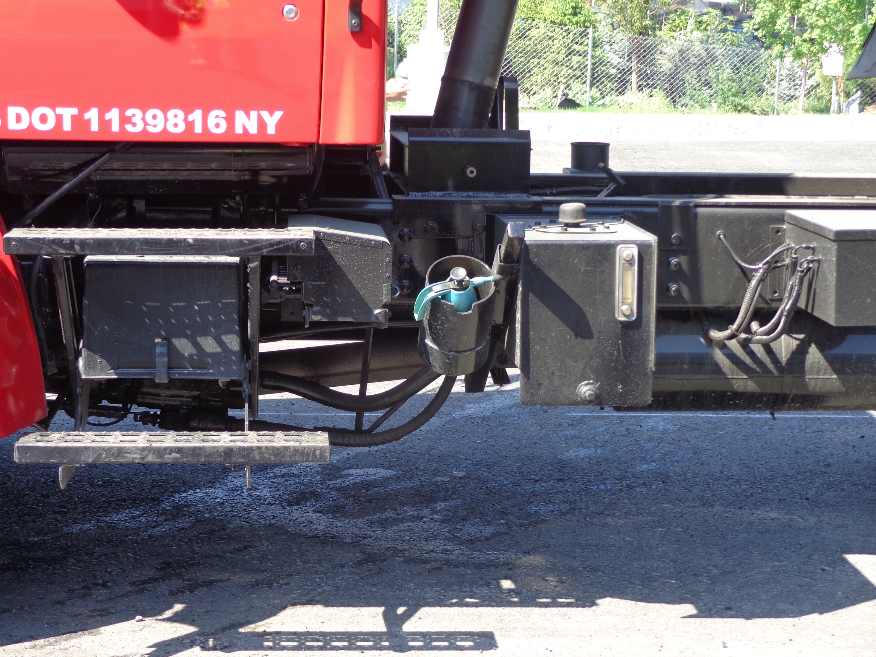 The mechanic has welded a bucket-like receptacle behind the truck’s cab to hold the spray can of release agent where it is easy to reach, yet out of the way.