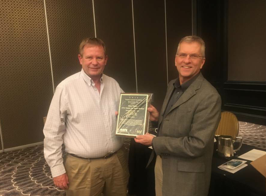 Scherschligt presents Ross Weber of APAC Kansas, Inc., with a plaque recognizing his service to KAPA.