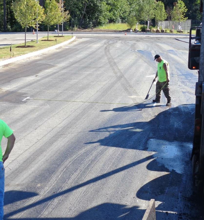 The foreman will either line out the job himself or work with the laborers to line it out, measuring and marking the lanes to be paved so the project finishes in its most timely fashion with no wasted material.