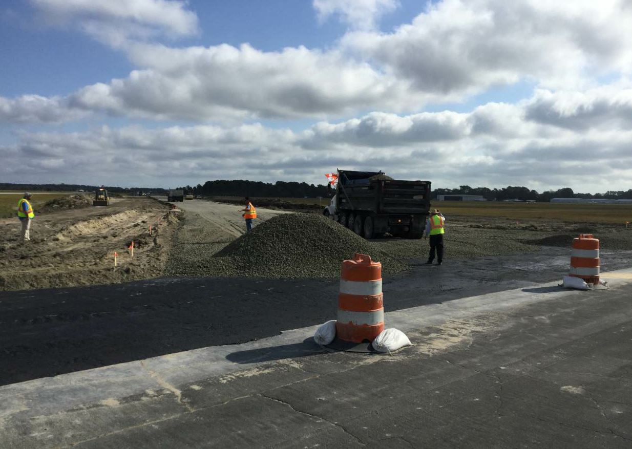 The crew placed 8 inches of P-209 crushed aggregate base course on the taxiway. A GPS grade control system also served as a tool for precision fine grading during the stone-base portion of the project.
