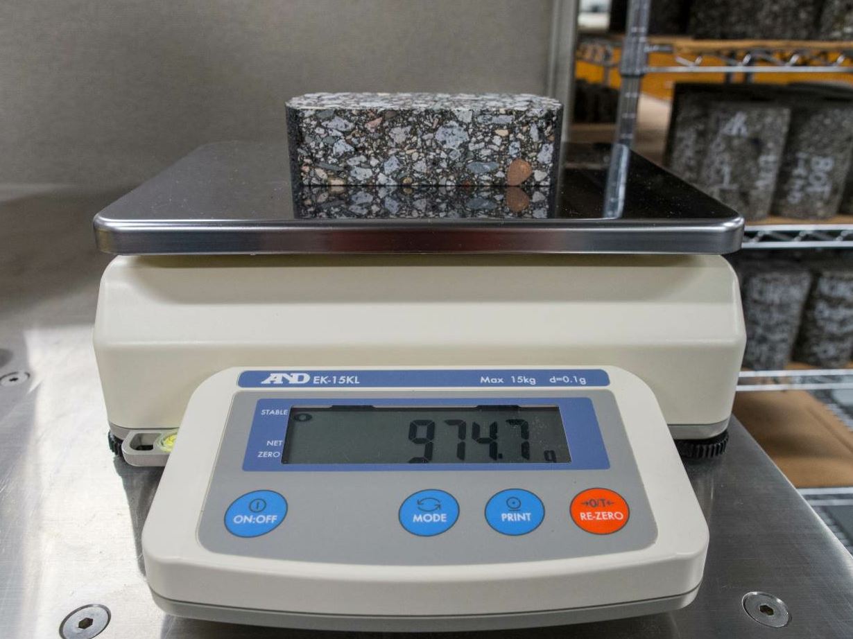 Every sample, puck or core in the lab has been on a scale at some point during its testing process. The importance of the scale’s accuracy cannot be overstated. Photo courtesy NCAT.