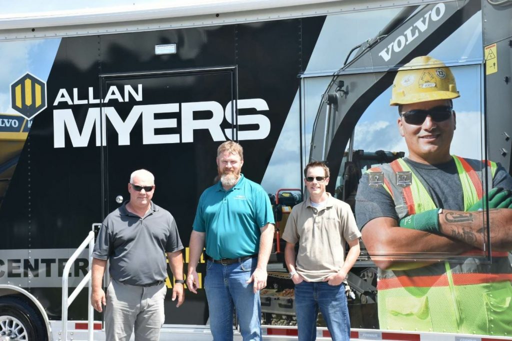 From left: Bill McGowan of Allan Myers, Danny Freeman of Volvo CE, and Andrew Hoffman of Allan Myers display the new Myers Mobile Training Center, which is a fundamental part of the new Stepping Up program at the company.