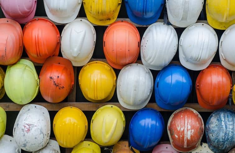 Lots of hardhats lined up in rows