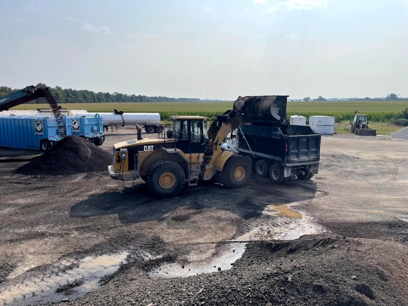 At the cold central plant recycling yard, the mix is blended in the pugmill and loaded into trucks for delivery to the job site.
