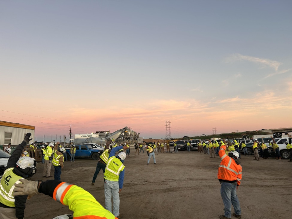 A Granite crew in Texas performs “Stretch and Flex” as part of its daily safety meeting.
